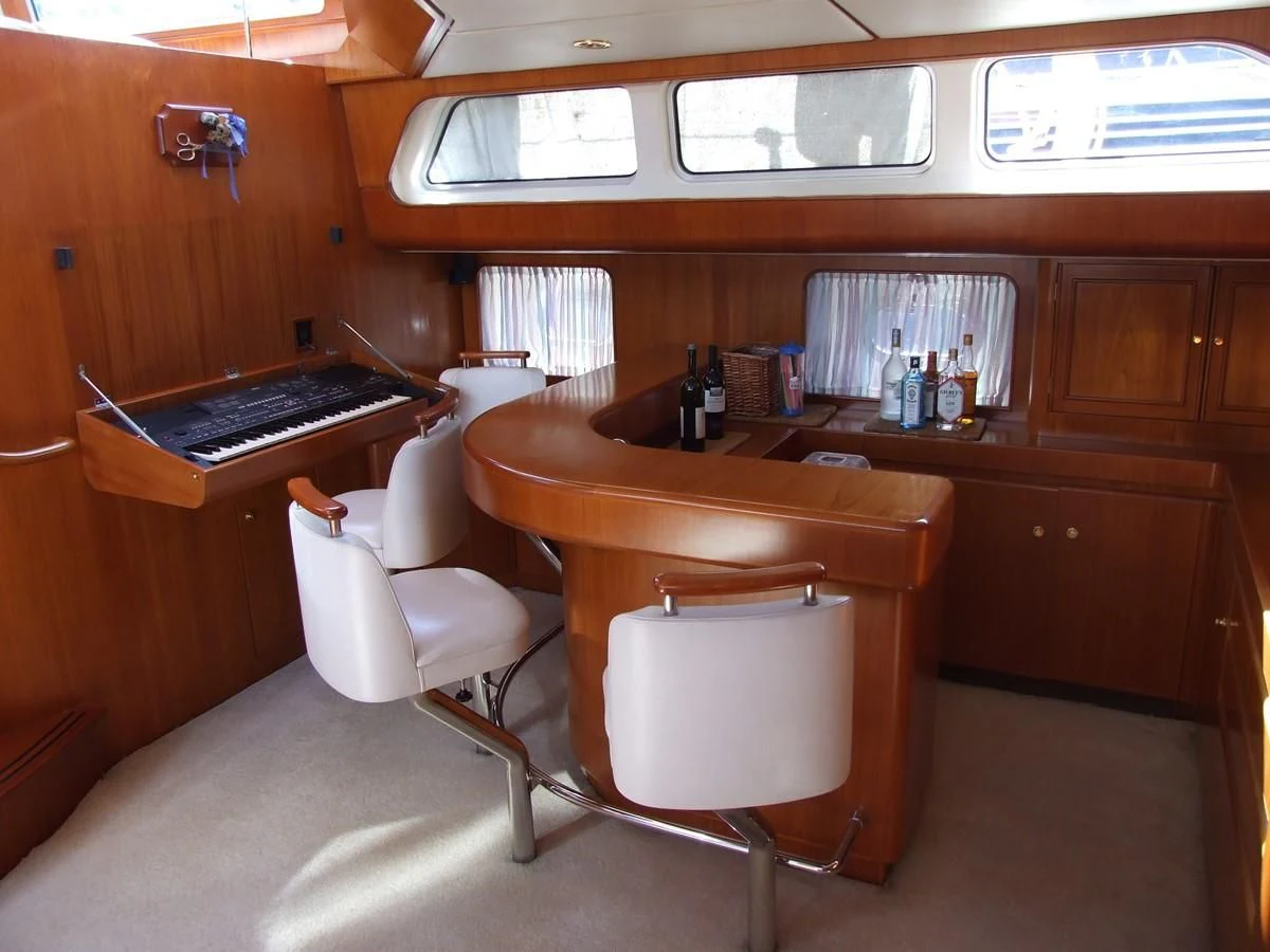 a white chair in a room aboard IMPRESSION Yacht for Sale
