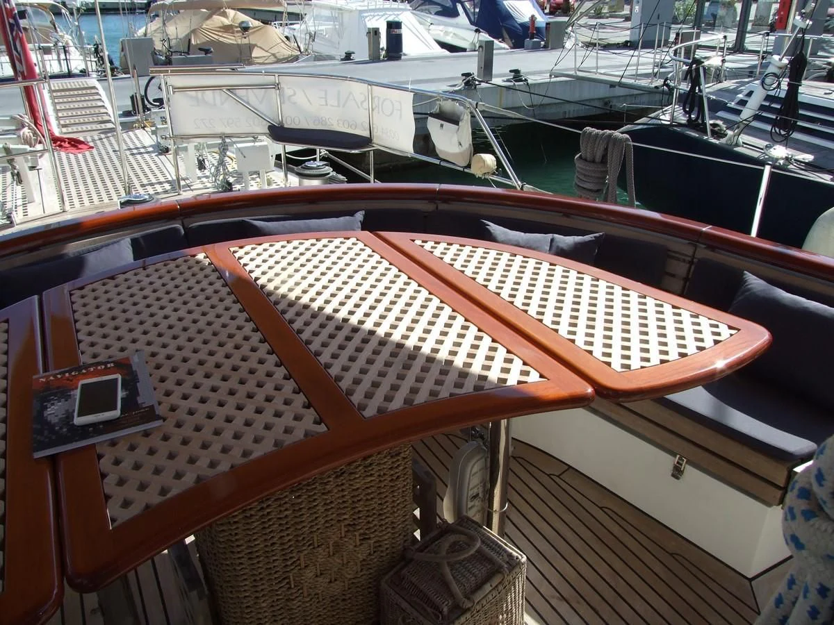 a large boat in a harbor aboard IMPRESSION Yacht for Sale