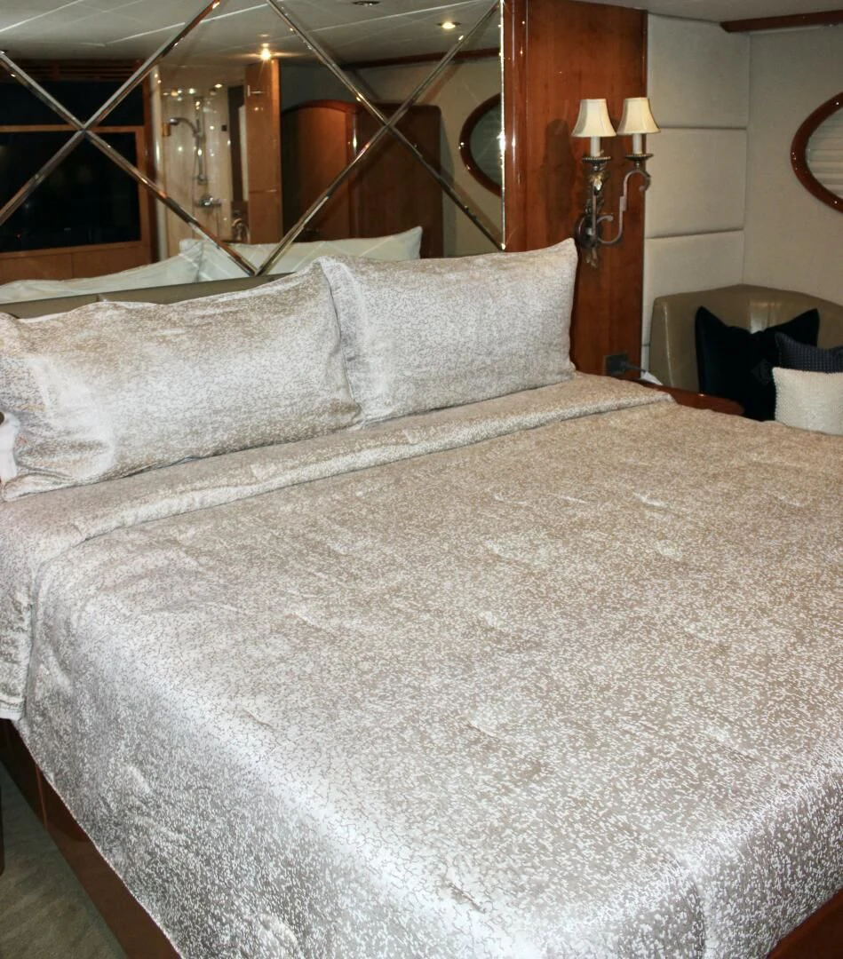 a bed with white sheets aboard KATHLEEN Yacht for Sale