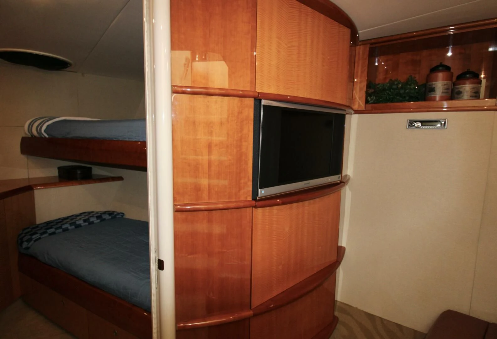 a room with a bed and a television aboard KATHLEEN Yacht for Sale