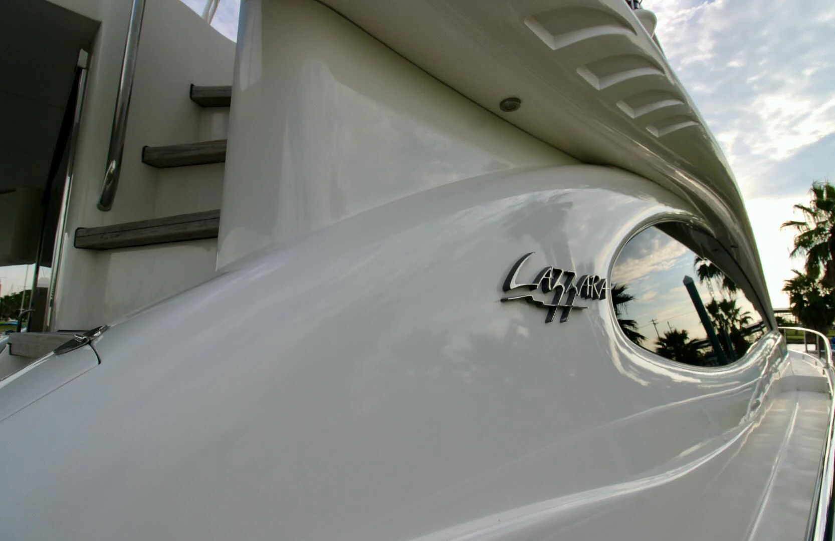 a white car with a logo on it aboard KATHLEEN Yacht for Sale