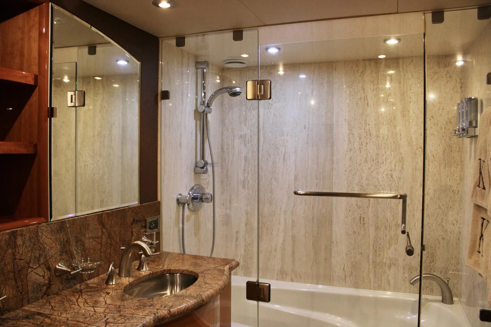 a bathroom with a glass shower aboard KATHLEEN Yacht for Sale