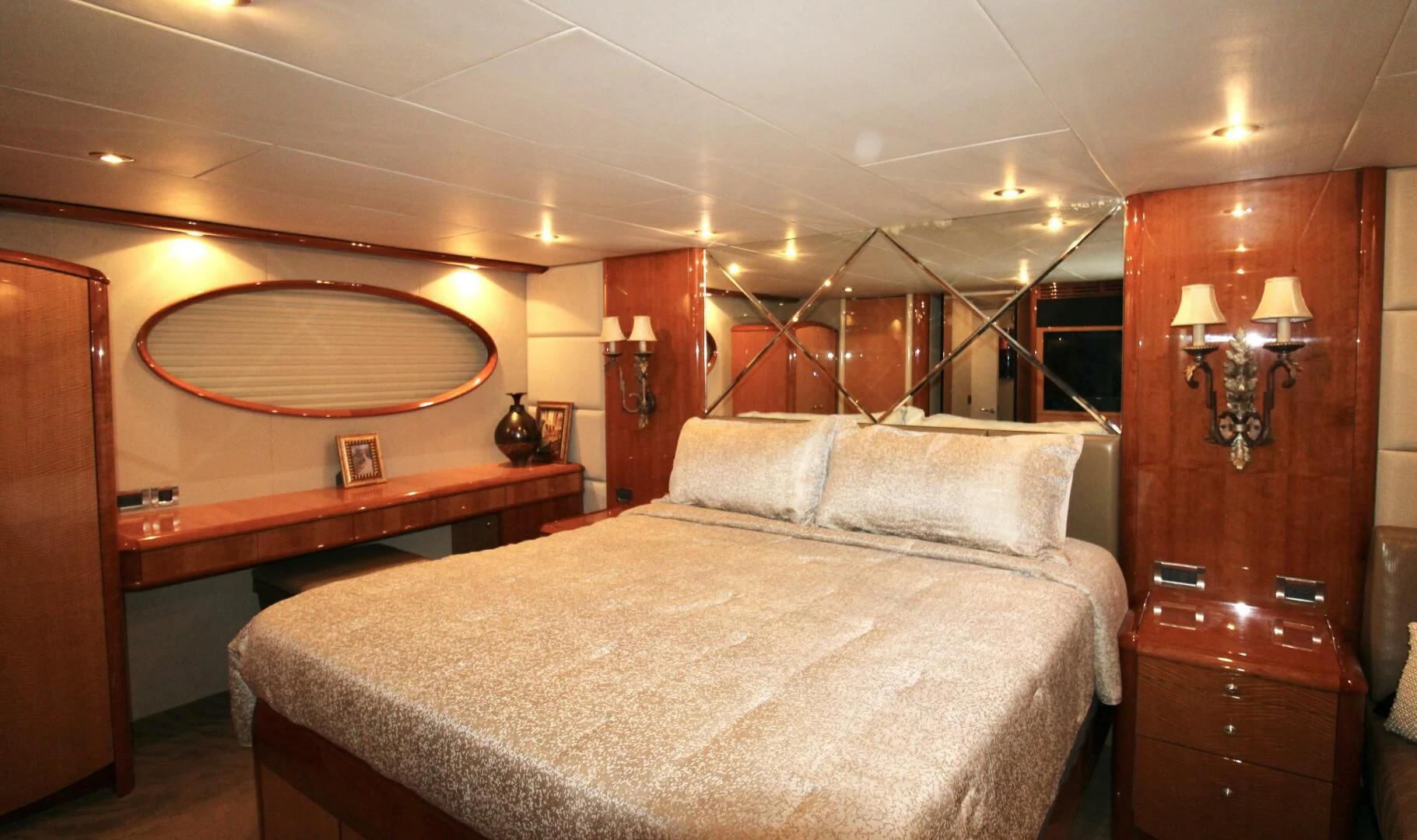 a bedroom with a bed and a lamp aboard KATHLEEN Yacht for Sale