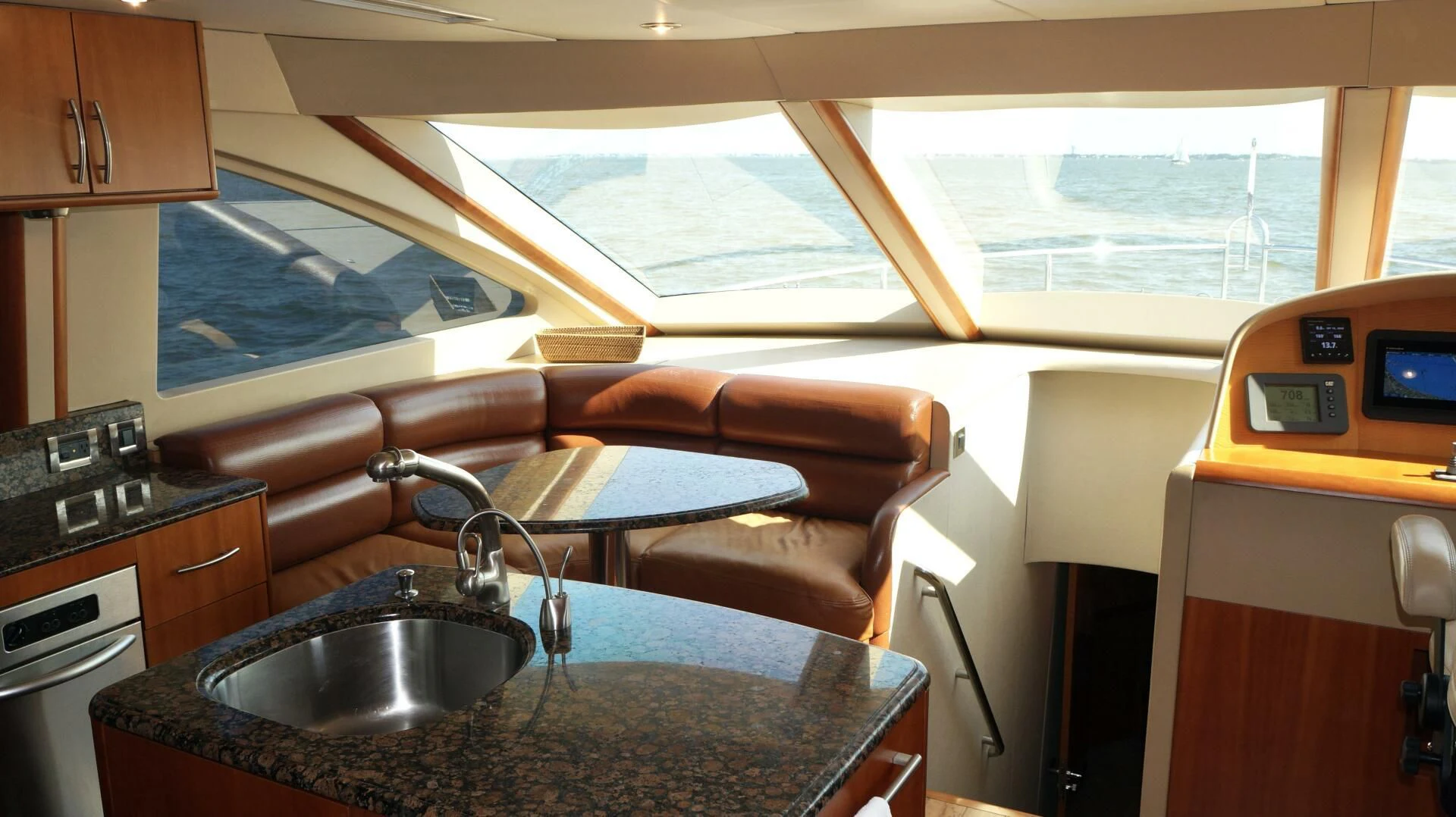 a kitchen with a sink and a couch aboard KATHLEEN Yacht for Sale