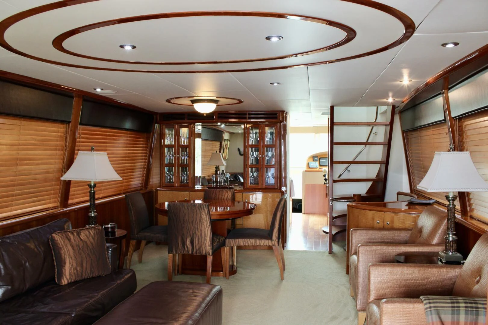 a living room with a large table and chairs aboard KATHLEEN Yacht for Sale