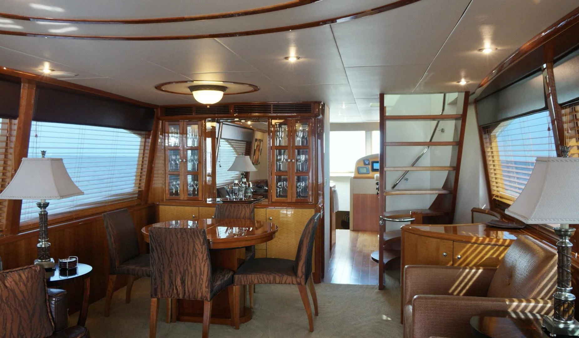 a living room with a bookcase aboard KATHLEEN Yacht for Sale