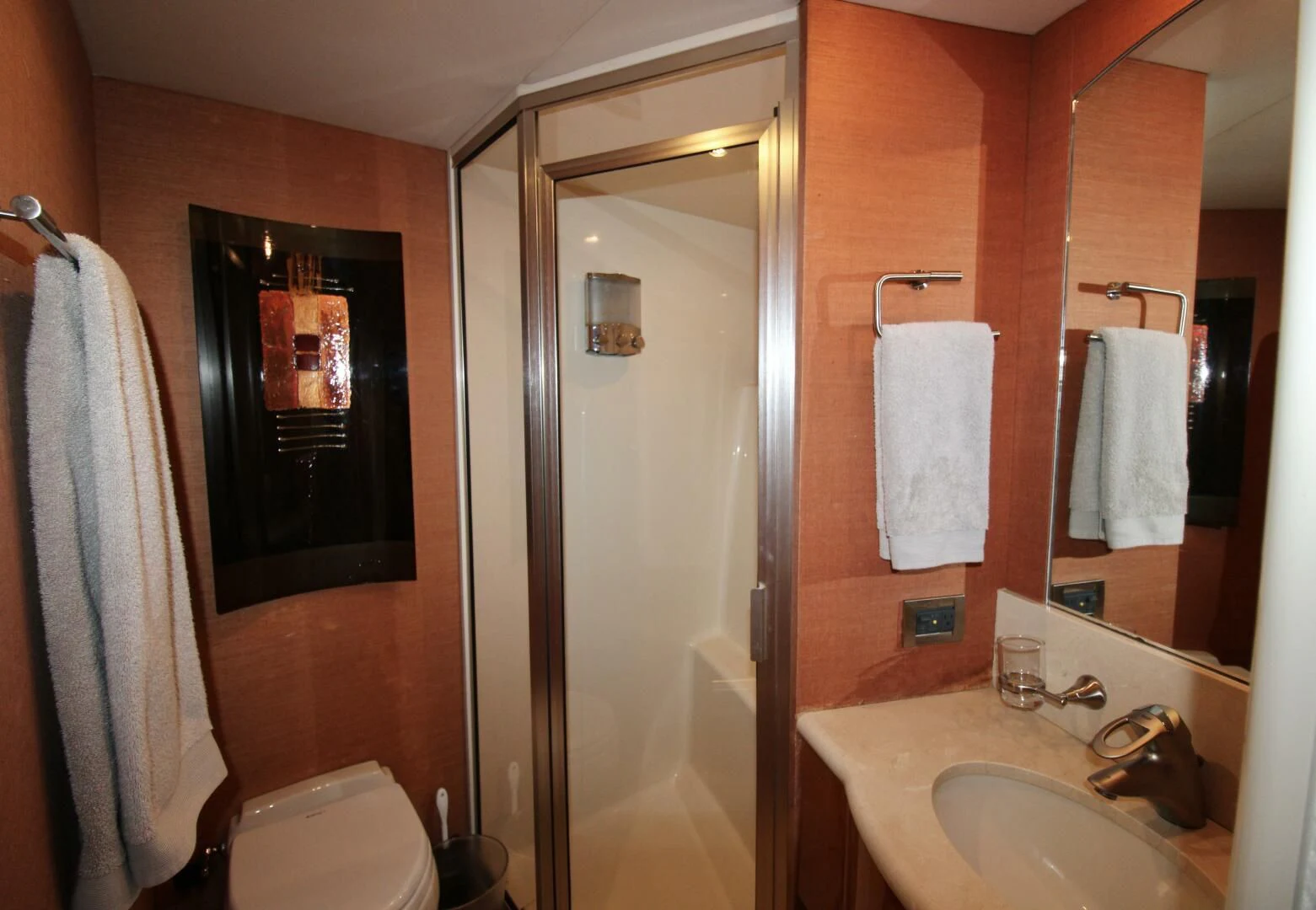 a bathroom with a mirror and sink aboard KATHLEEN Yacht for Sale