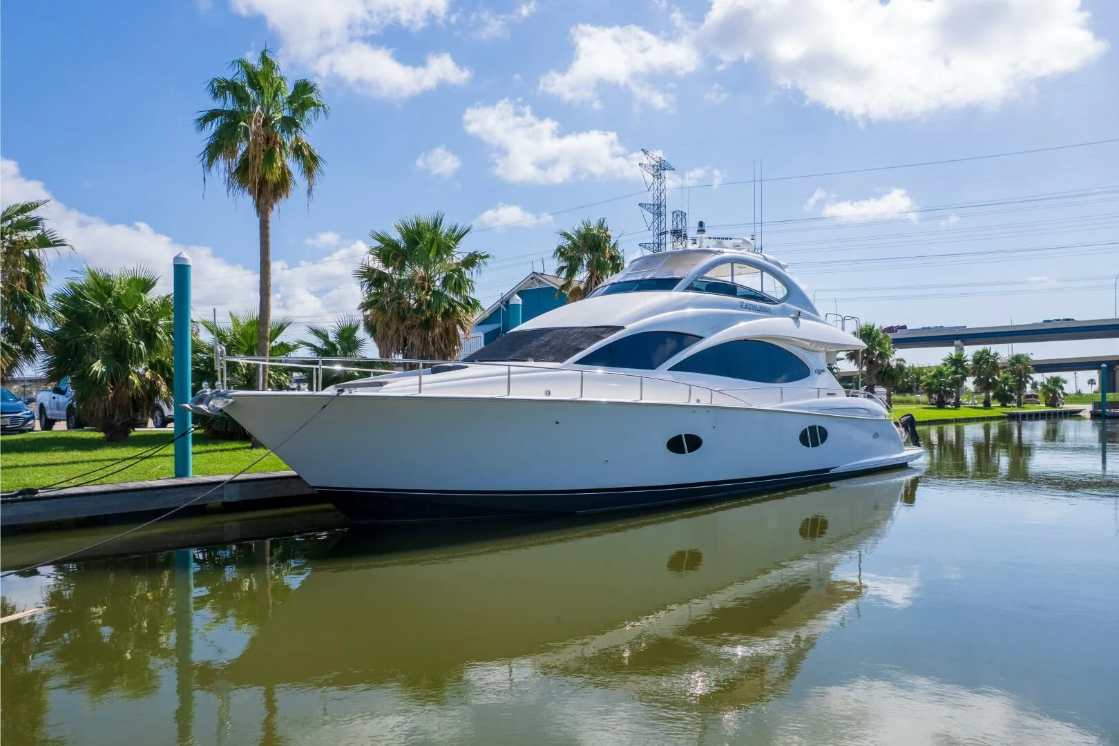 a white boat in a body of water aboard KATHLEEN Yacht for Sale