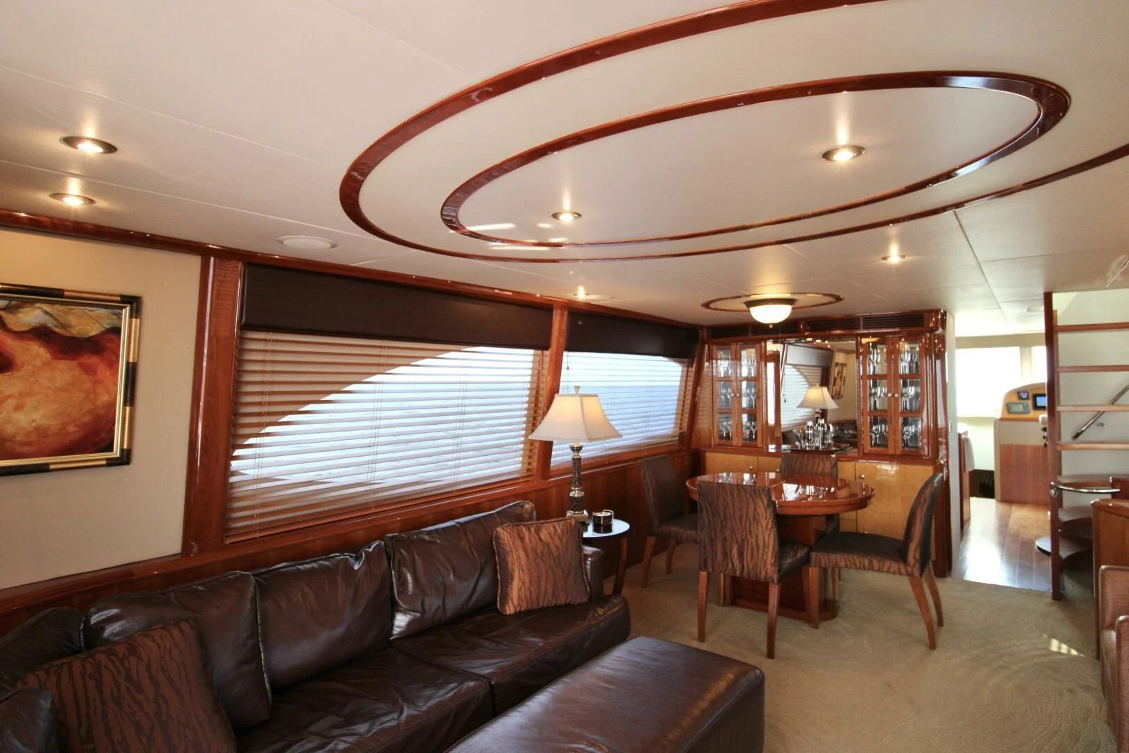 a living room with a leather couch and a wood table aboard KATHLEEN Yacht for Sale