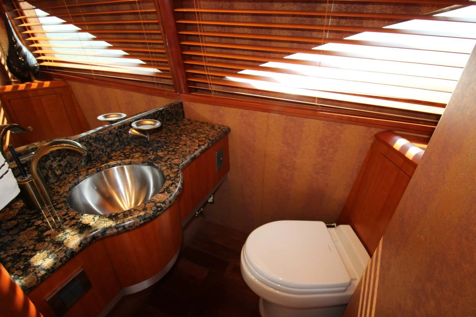 a bathroom with a sink and toilet aboard KATHLEEN Yacht for Sale