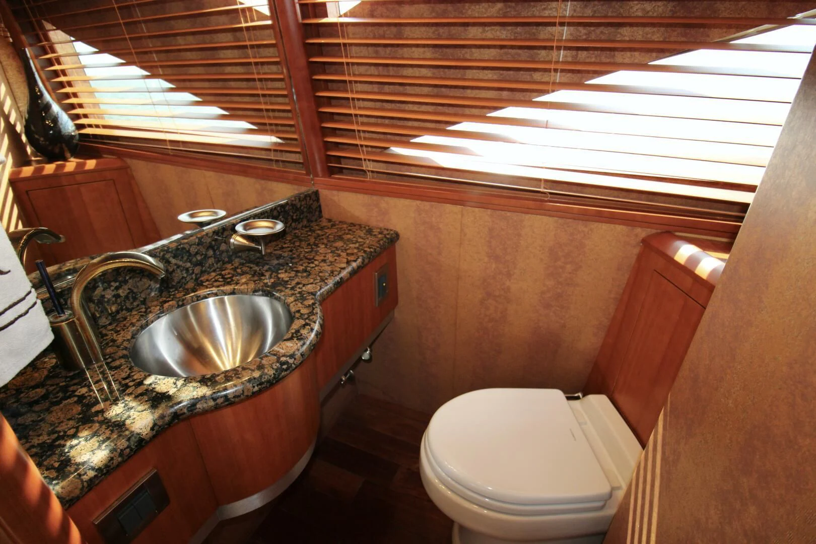 a bathroom with a sink and toilet aboard KATHLEEN Yacht for Sale