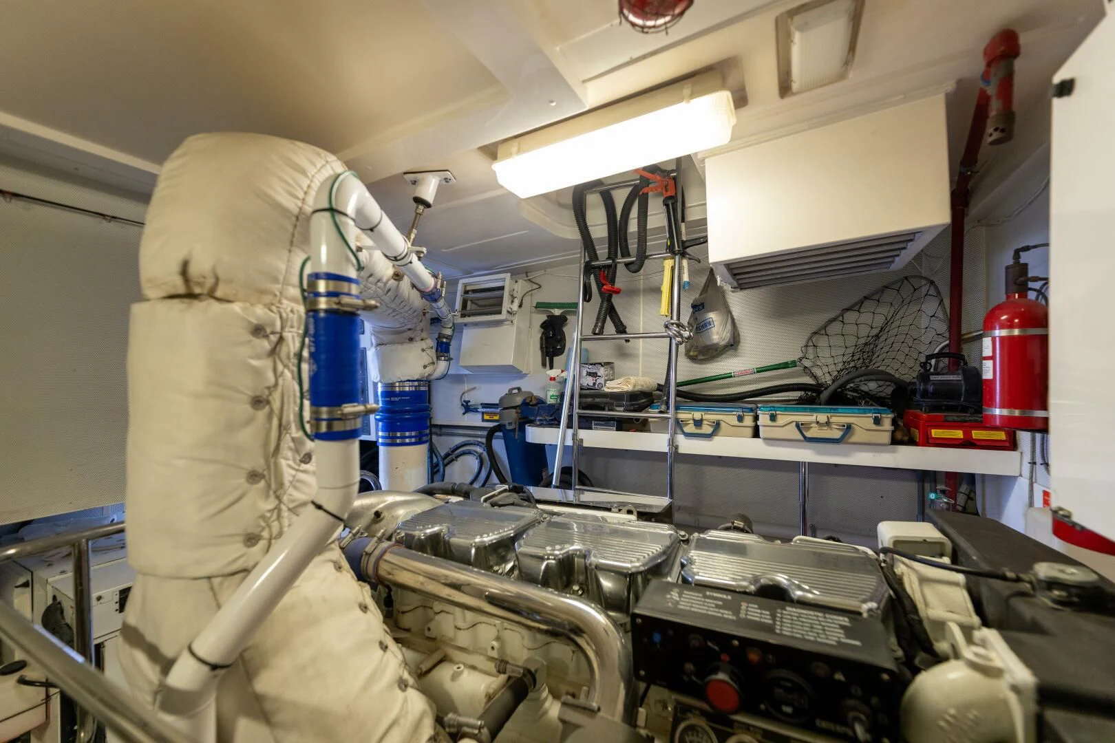 a person in a white coat working in a factory aboard KATHLEEN Yacht for Sale