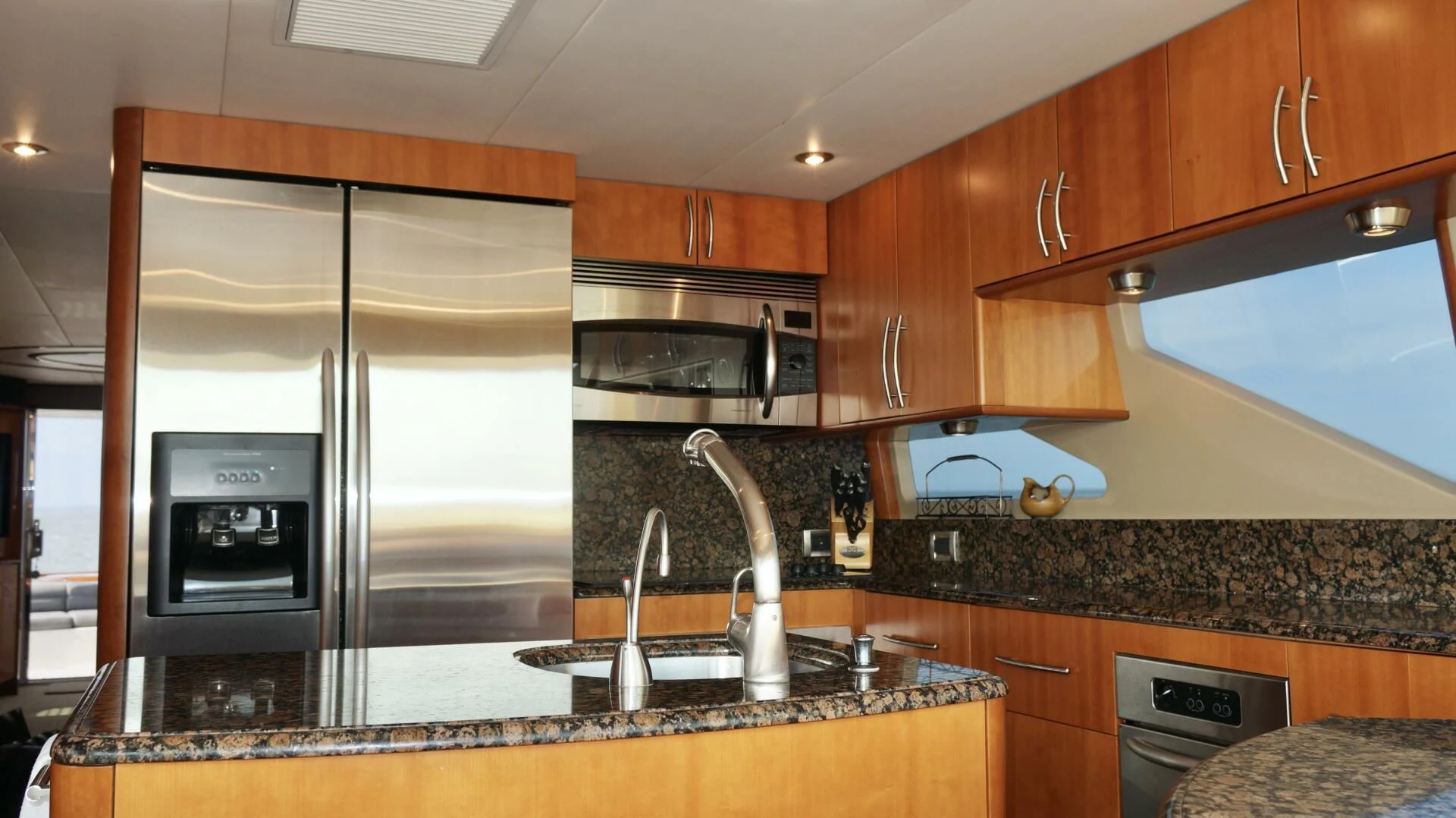 a kitchen with a large refrigerator aboard KATHLEEN Yacht for Sale