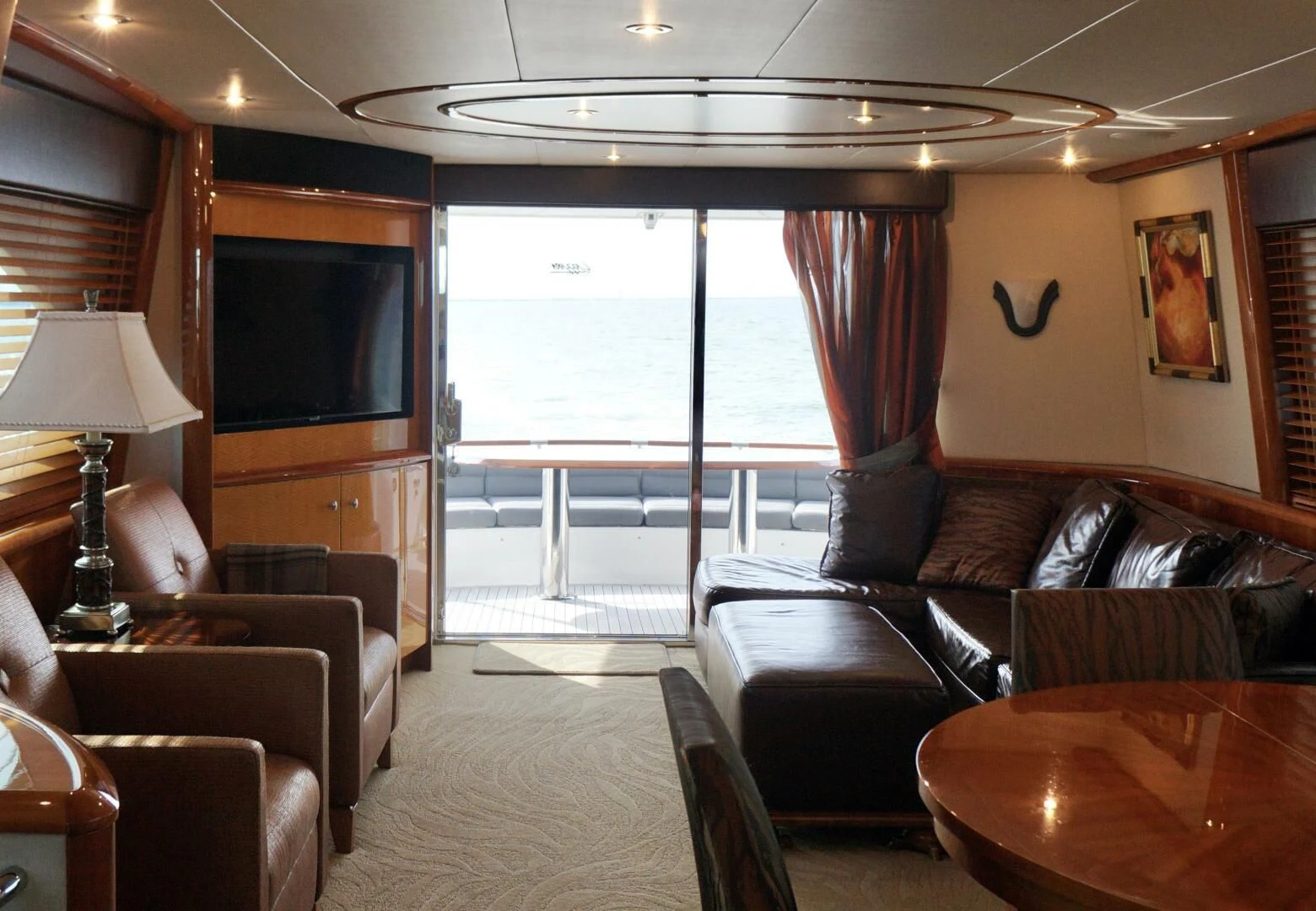 a living room with leather couches and a television aboard KATHLEEN Yacht for Sale
