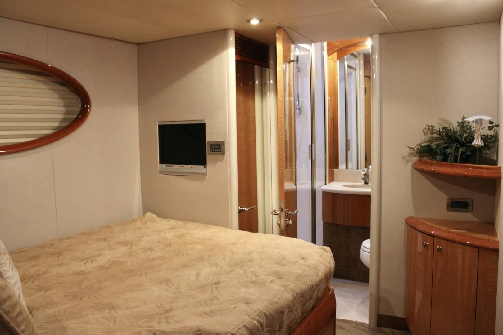 a bedroom with a bed and a television aboard KATHLEEN Yacht for Sale