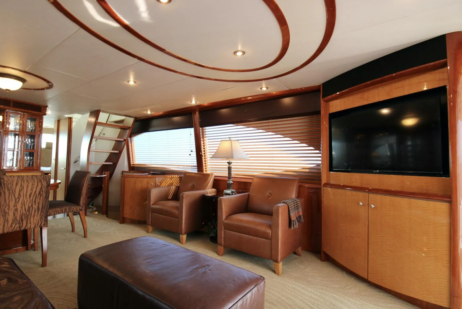 a living room with a tv and furniture aboard KATHLEEN Yacht for Sale