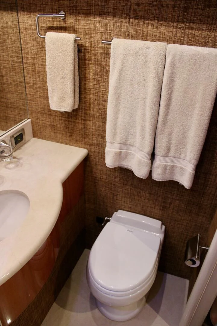 a bathroom with a toilet and sink aboard KATHLEEN Yacht for Sale