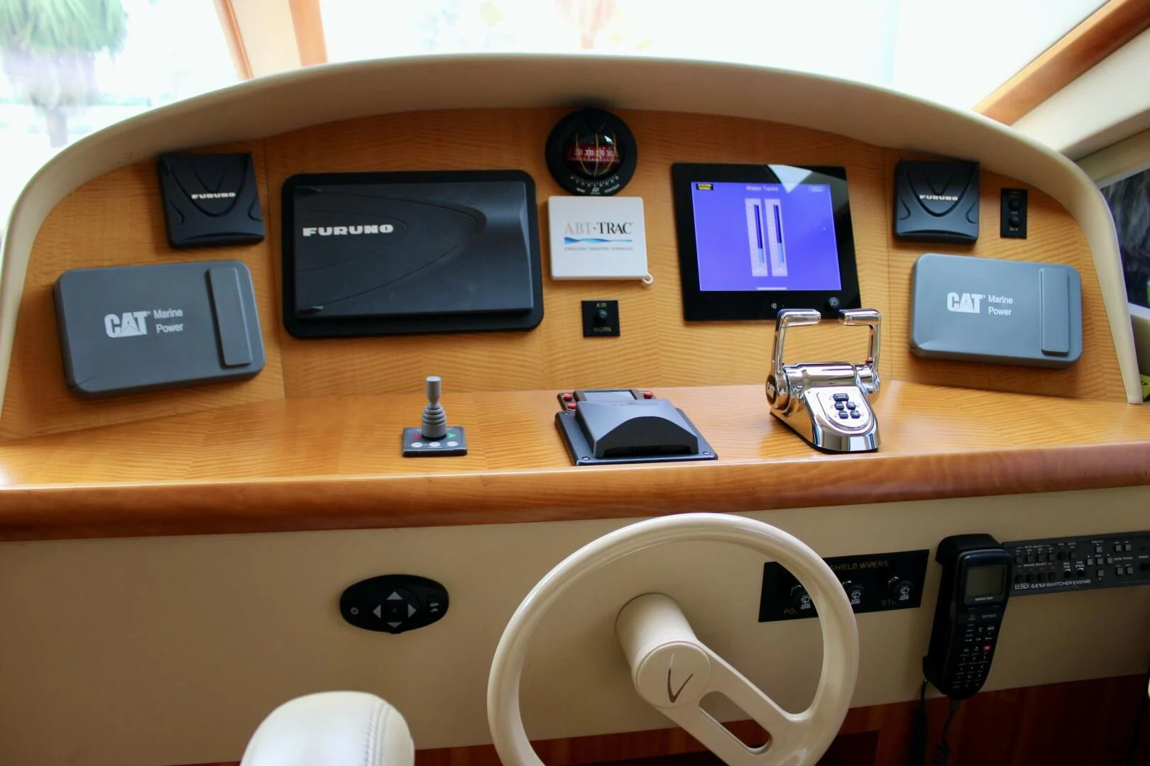 a desk with a phone and other electronics on it aboard KATHLEEN Yacht for Sale