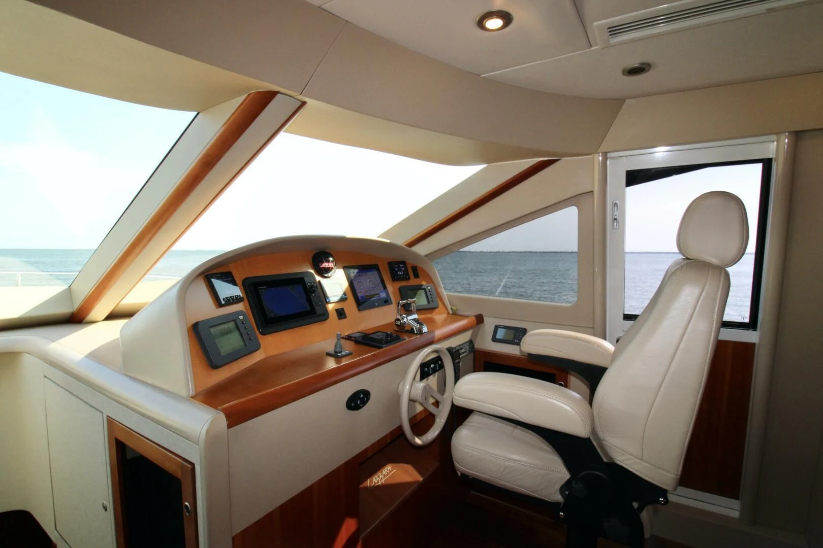 inside of a vehicle with a desk and chairs aboard KATHLEEN Yacht for Sale