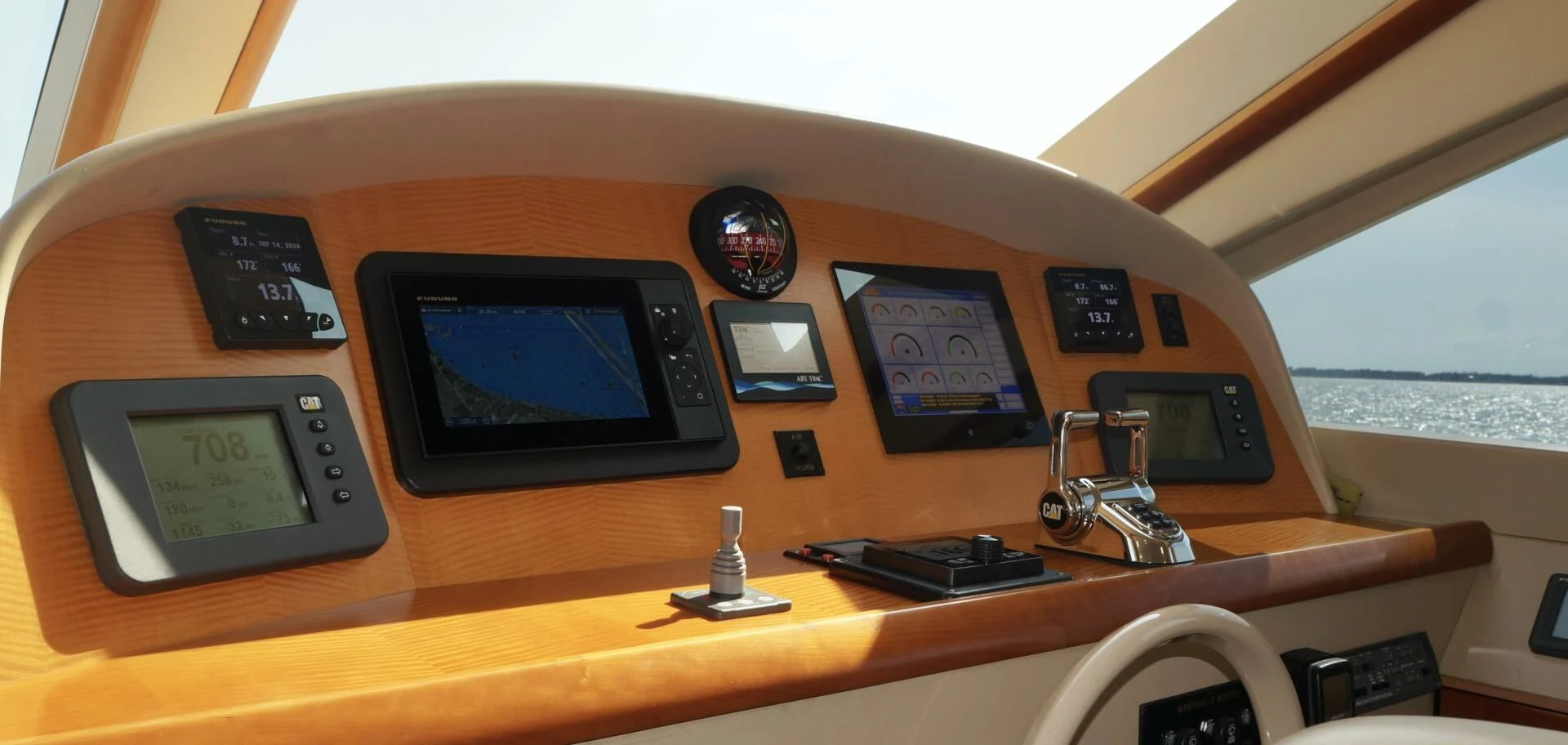 a wooden table with electronic devices aboard KATHLEEN Yacht for Sale