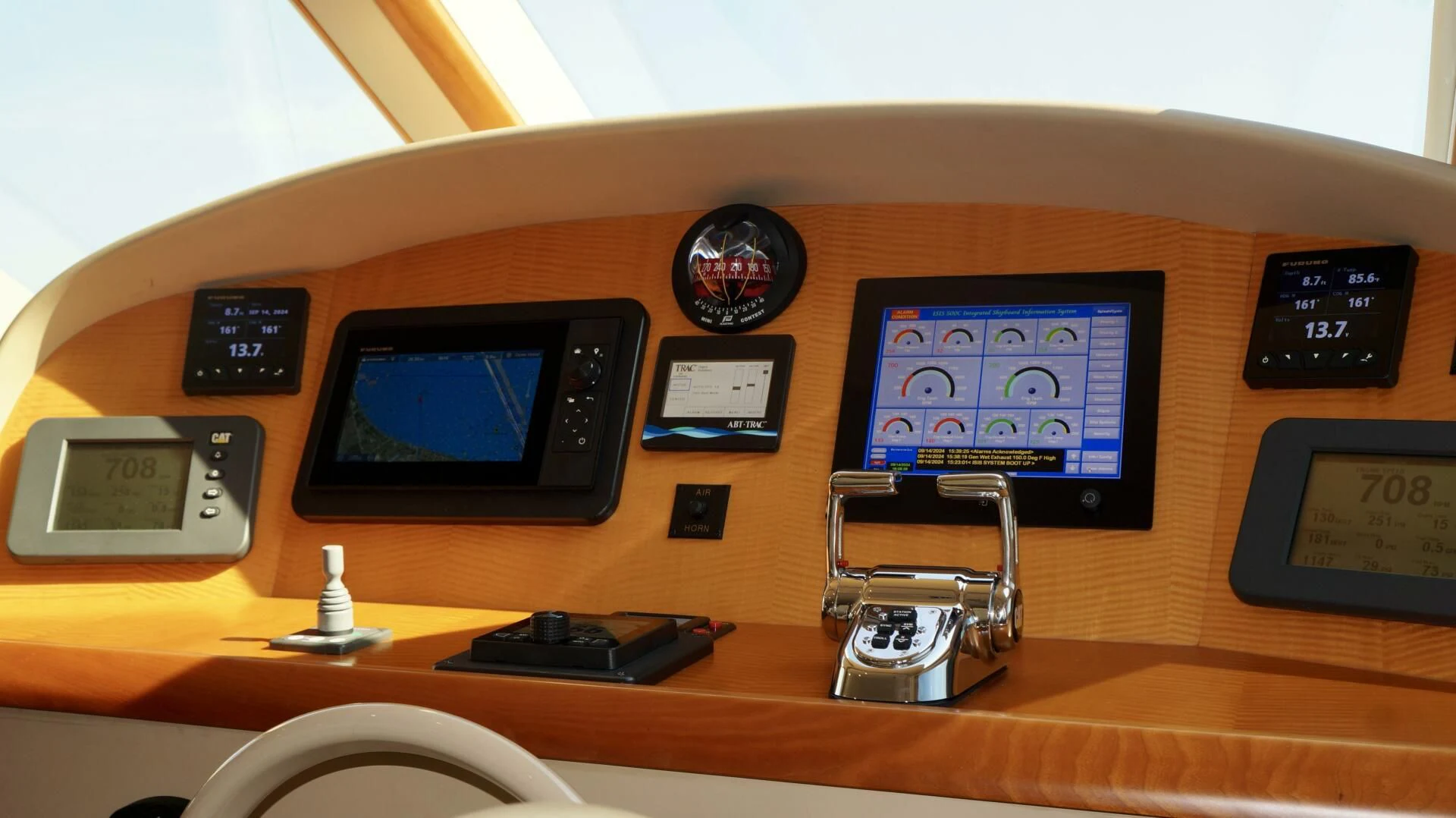 a desk with a computer and other electronic devices on it aboard KATHLEEN Yacht for Sale