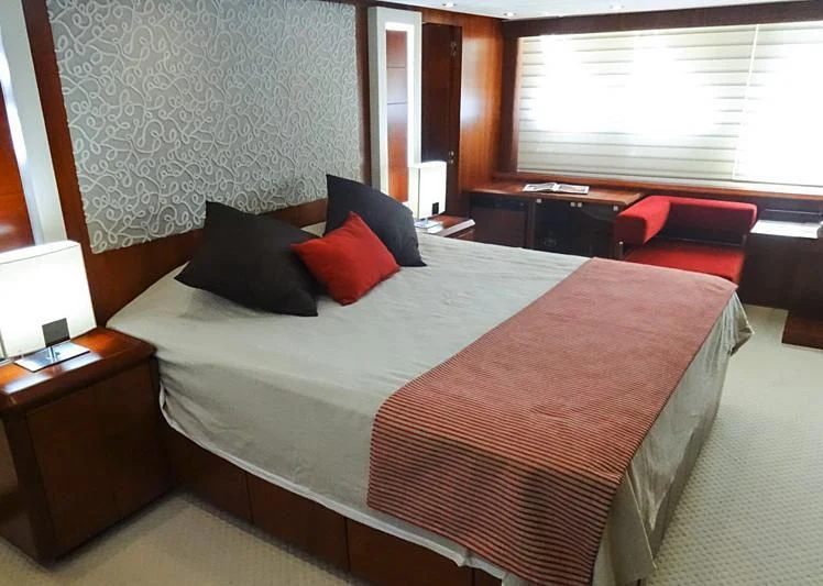 a bed with pillows on it aboard BISCARI Yacht for Sale