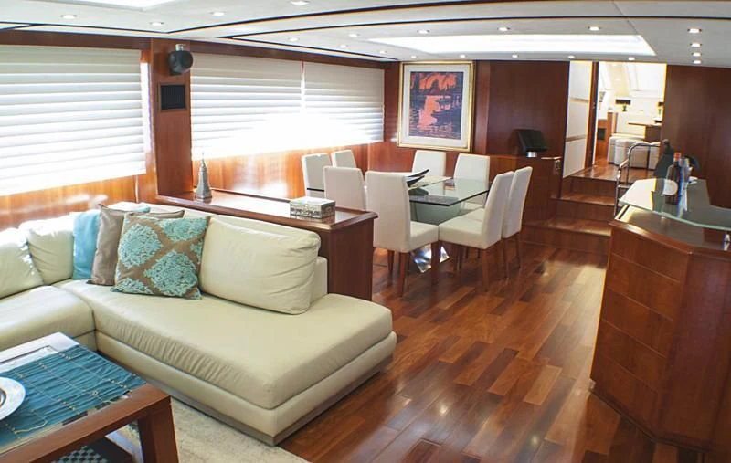 a living room with a couch and a table aboard BISCARI Yacht for Sale