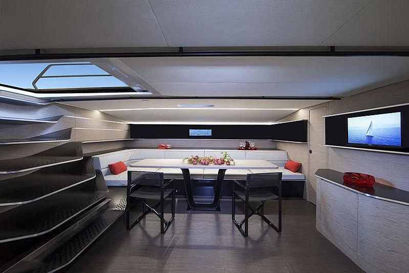 a room with a table and chairs aboard V Yacht for Sale