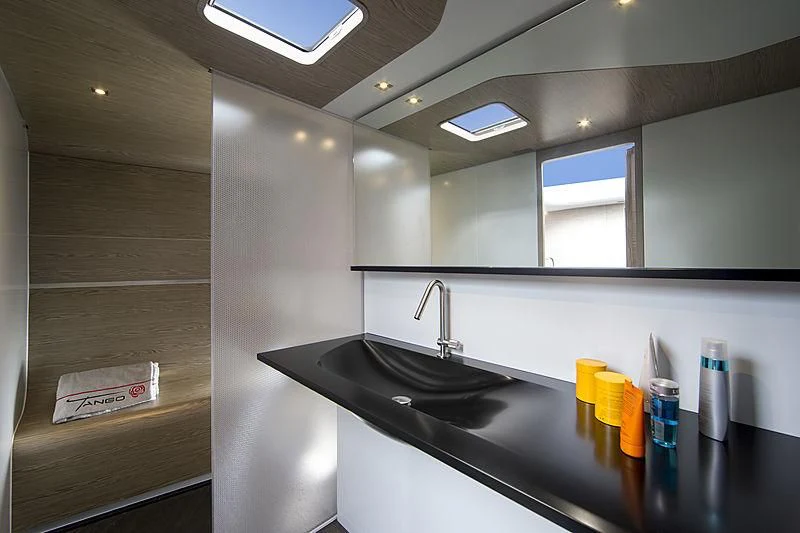 a bathroom with a sink and a mirror aboard V Yacht for Sale