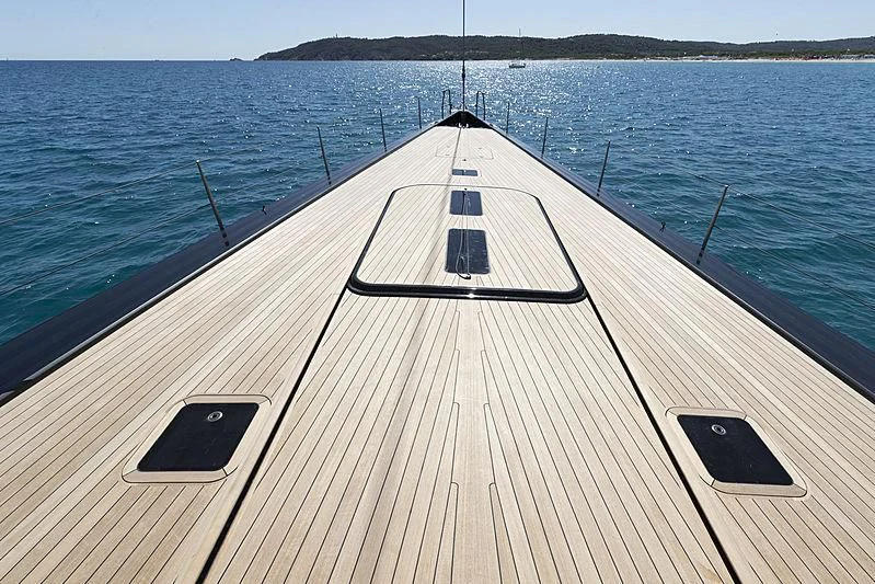 a long wooden boat on the water aboard V Yacht for Sale