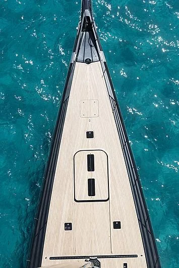 a boat with a large body of water in the background aboard V Yacht for Sale