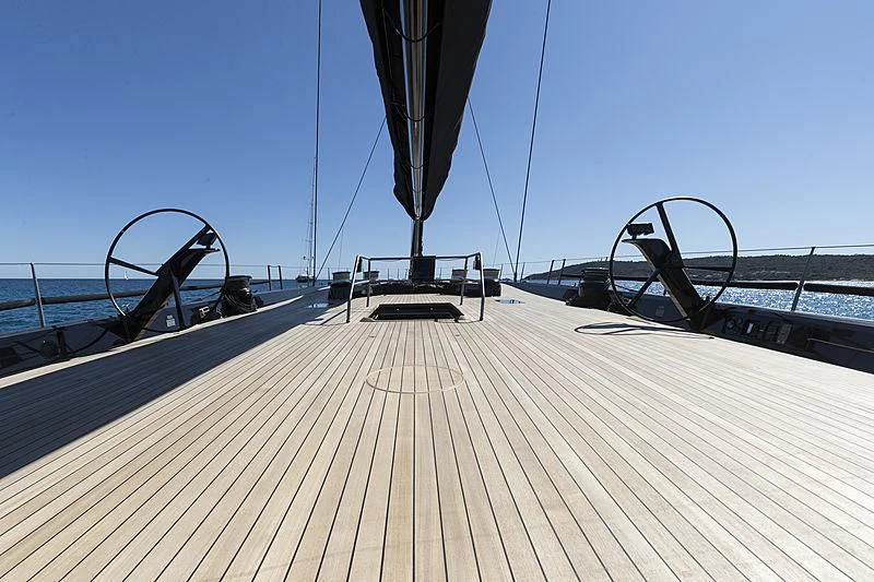 a large gun on a wooden deck aboard V Yacht for Sale