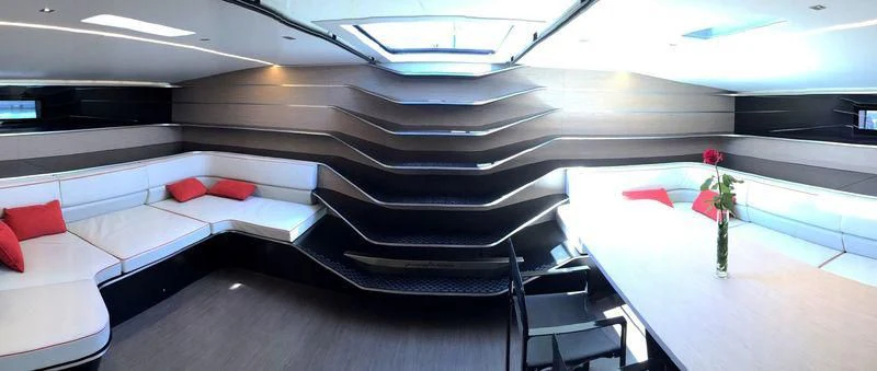 a room with a bed and a desk aboard V Yacht for Sale