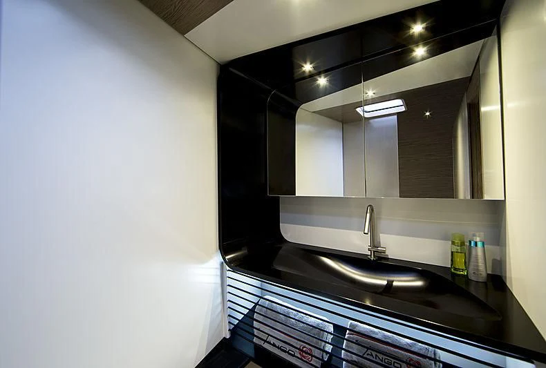 a kitchen with a sink and a mirror aboard V Yacht for Sale