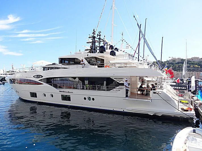a large white boat with people on it aboard CAROBELLE Yacht for Sale