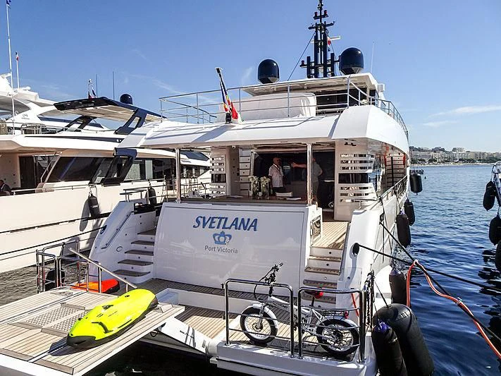a boat with a bicycle on the deck aboard CAROBELLE Yacht for Sale