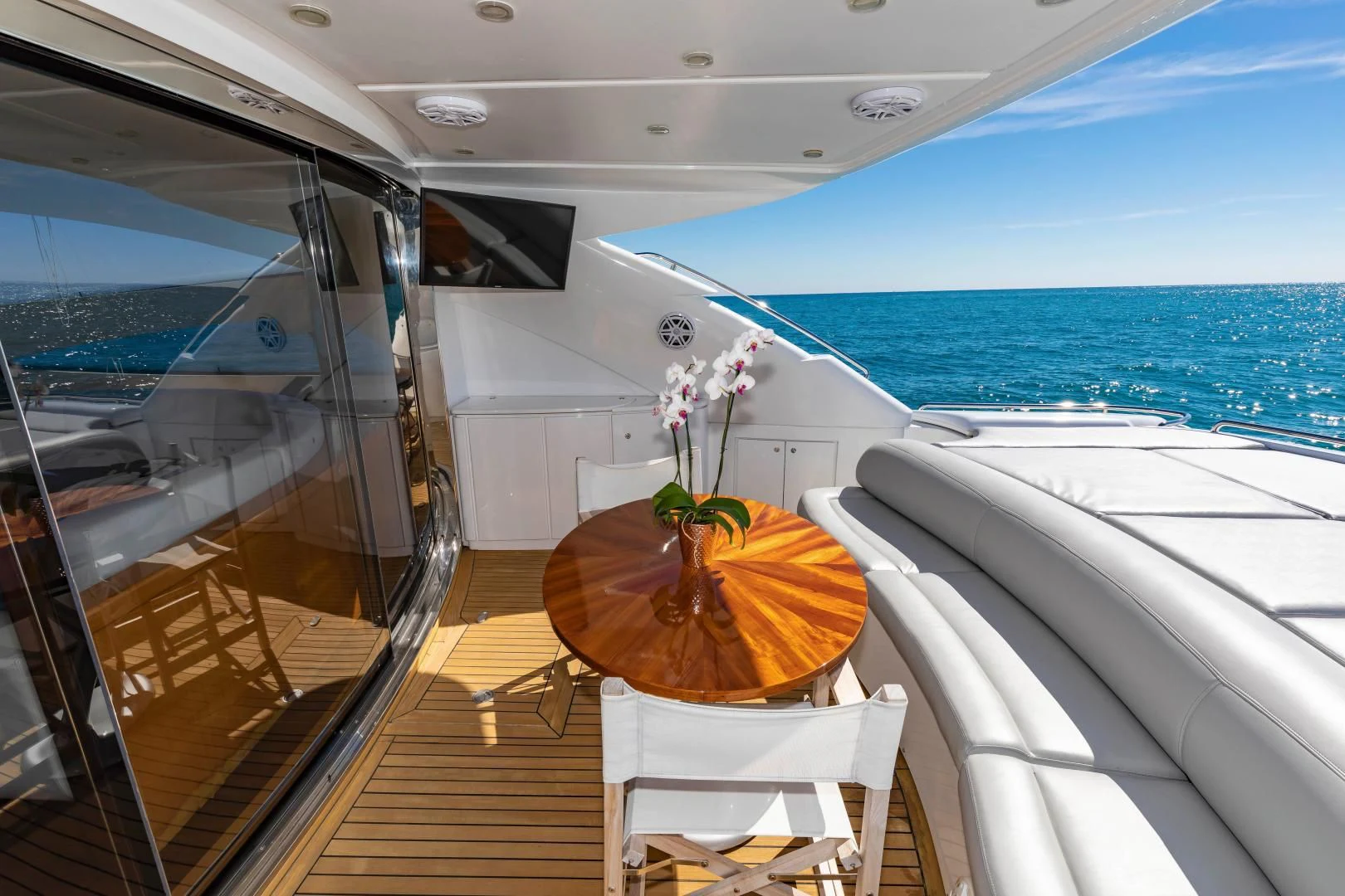 a boat with a table and chairs on the deck aboard FREE SPIRIT Yacht for Sale