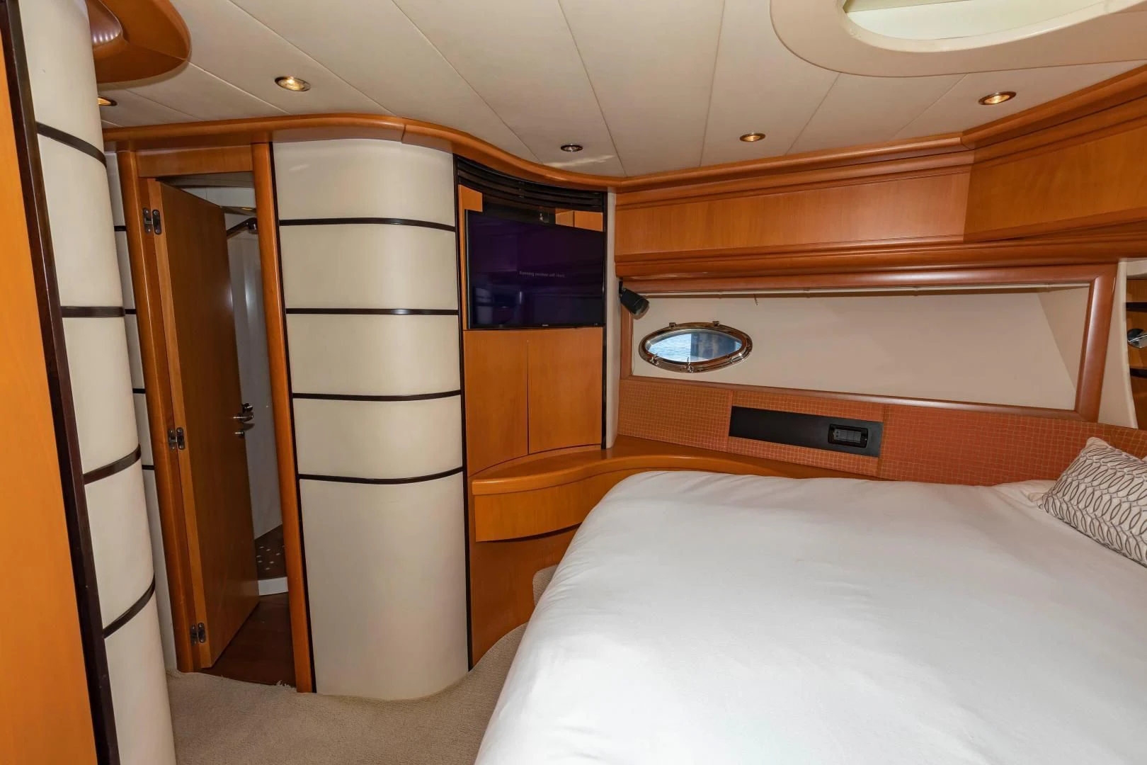 a room with a bed and a closet aboard FREE SPIRIT Yacht for Sale