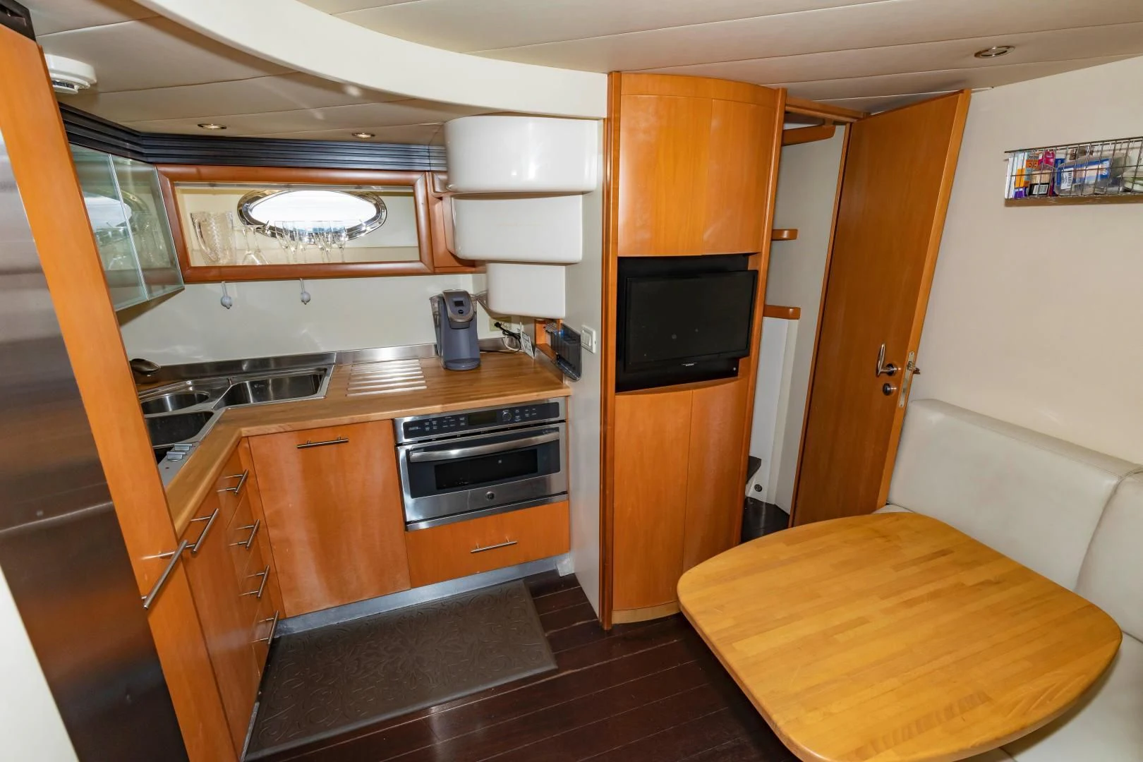a kitchen with wooden cabinets aboard FREE SPIRIT Yacht for Sale