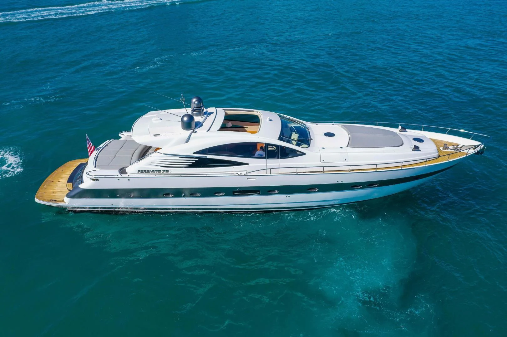 a white yacht in the water aboard FREE SPIRIT Yacht for Sale