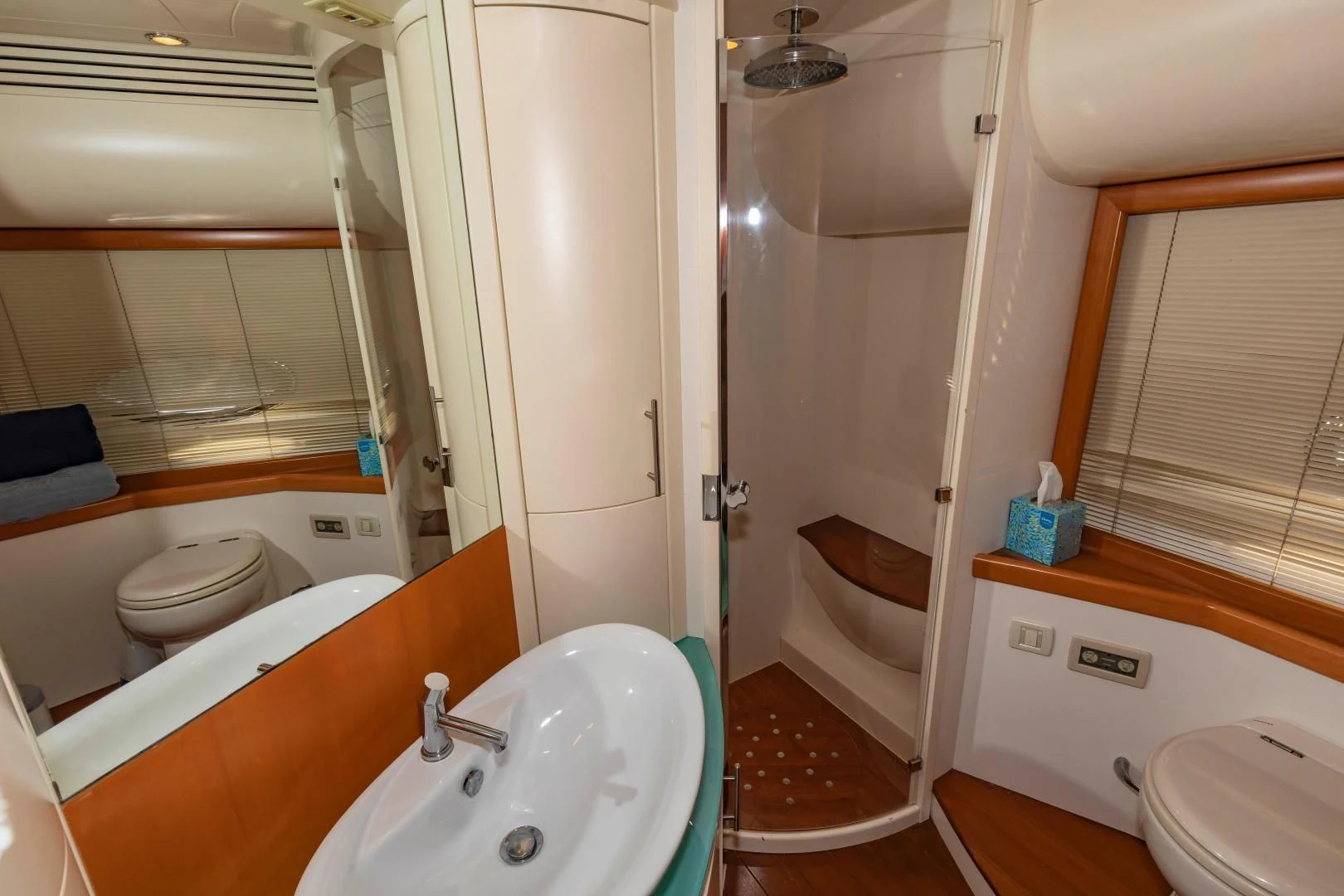 a bathroom with a tub sink and toilet aboard FREE SPIRIT Yacht for Sale