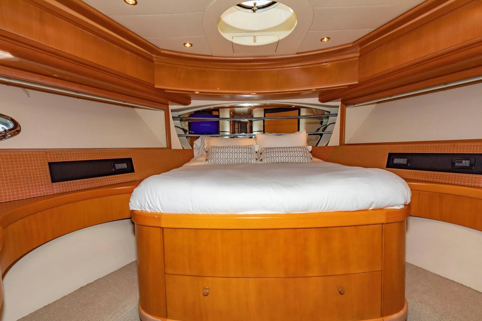 a bed with a wooden headboard aboard FREE SPIRIT Yacht for Sale
