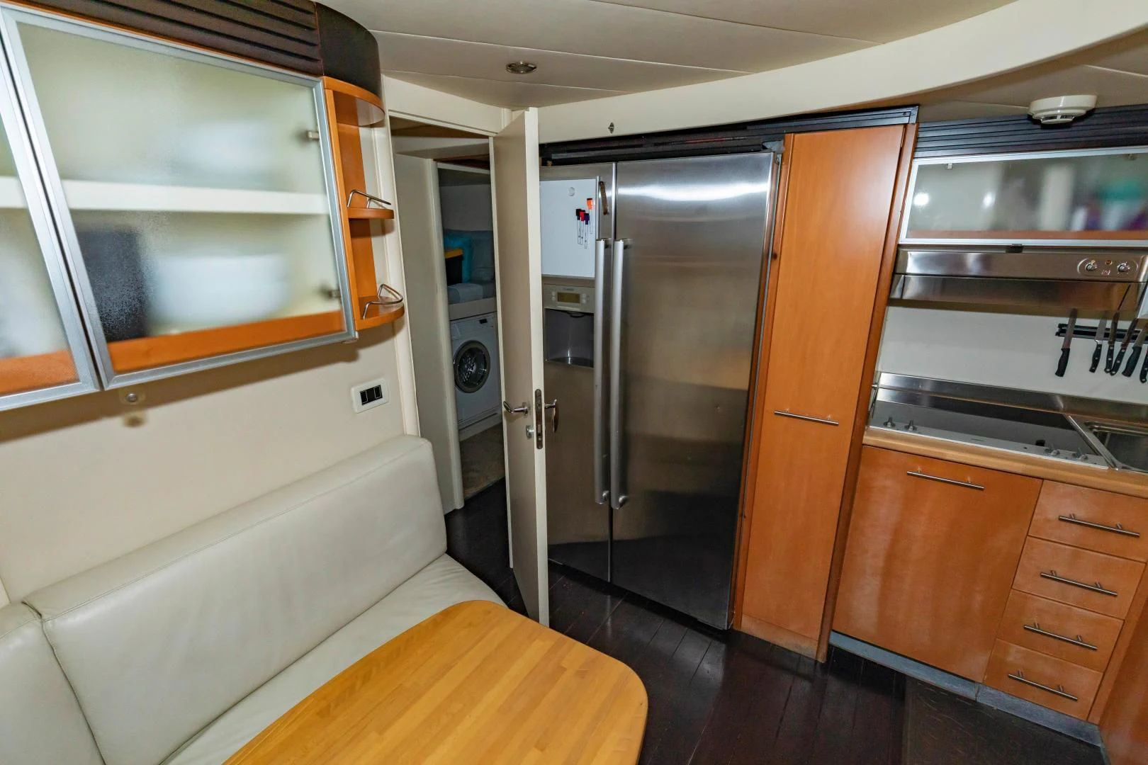 a kitchen with a large refrigerator aboard FREE SPIRIT Yacht for Sale