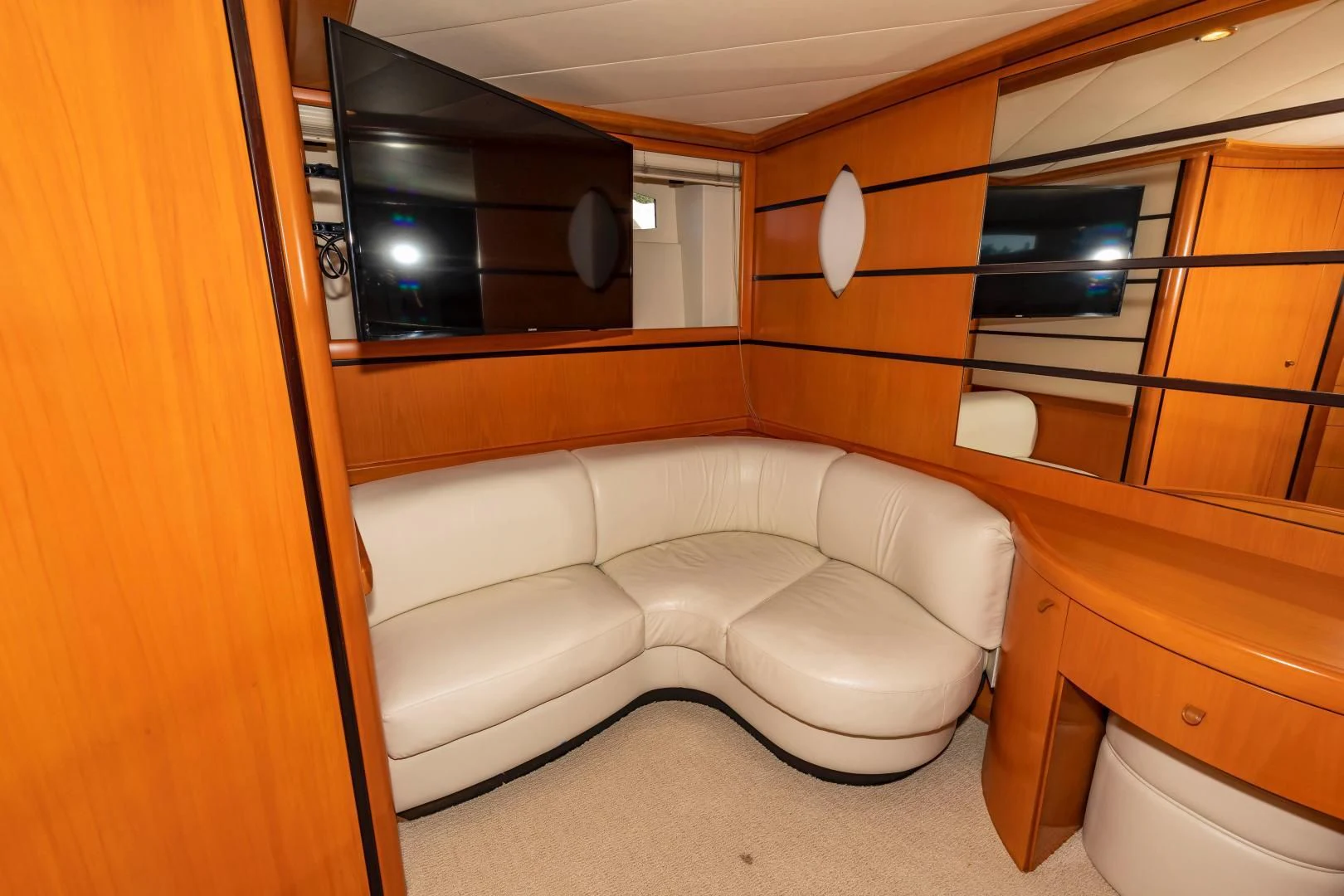 a room with a bed and a mirror aboard FREE SPIRIT Yacht for Sale