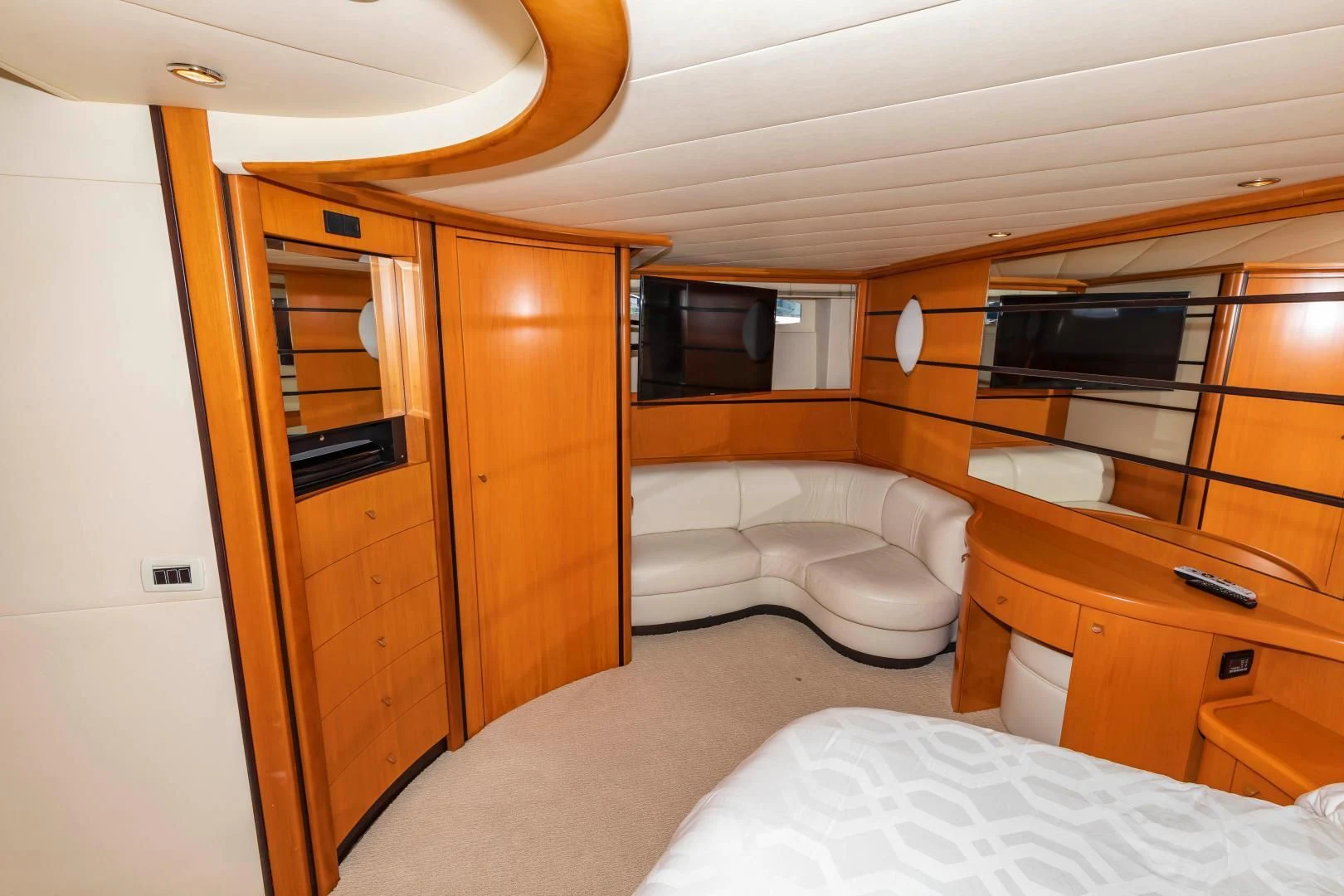 a room with a bed and a television aboard FREE SPIRIT Yacht for Sale