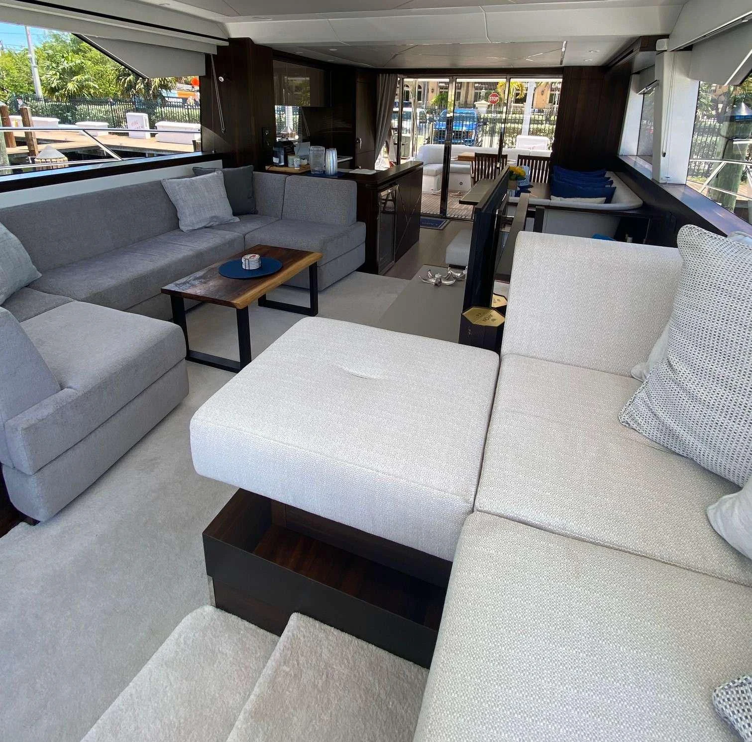 a couch and a table in a room aboard LAGO PARADISE Yacht for Sale