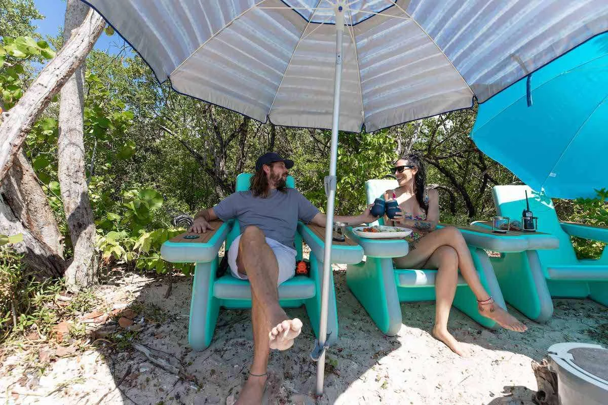 two women sitting under an umbrella aboard LAGO PARADISE Yacht for Sale