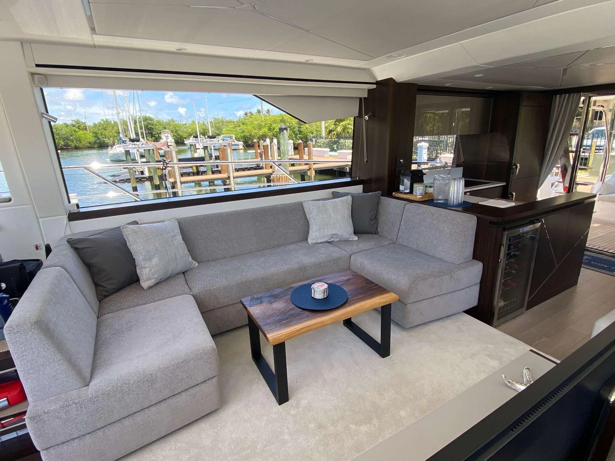 a living room with a couch and a coffee table aboard LAGO PARADISE Yacht for Sale