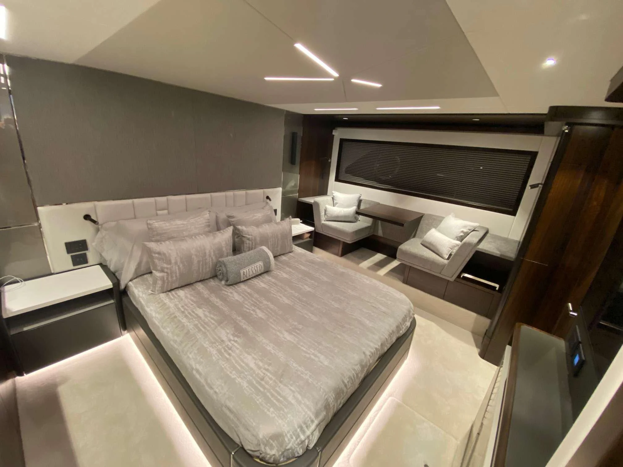 a large room with a bed and a tv aboard LAGO PARADISE Yacht for Sale