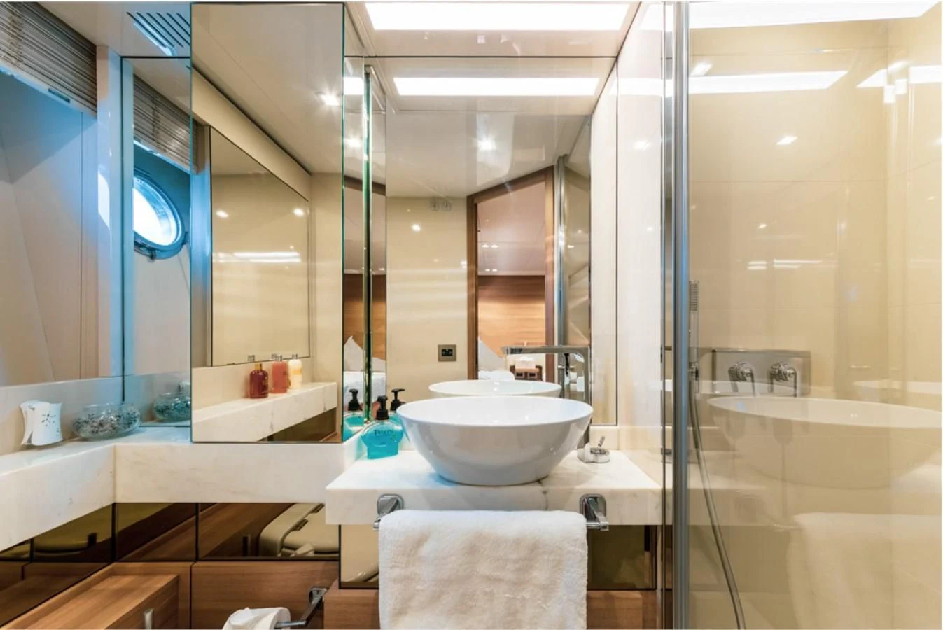 a bathroom with a large mirror aboard SEVEN Yacht for Sale
